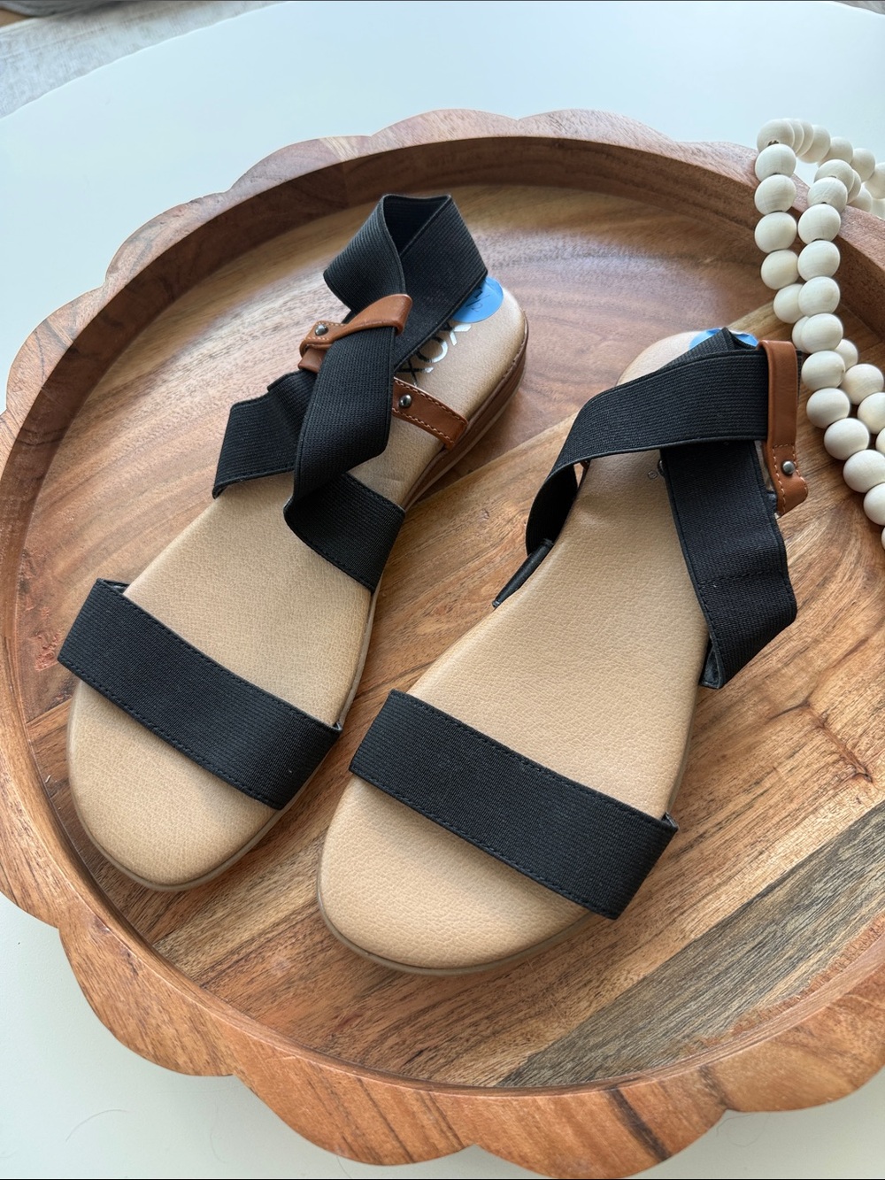 XOXO Women’s Black Elastic Strap Sandals with Tan Trim